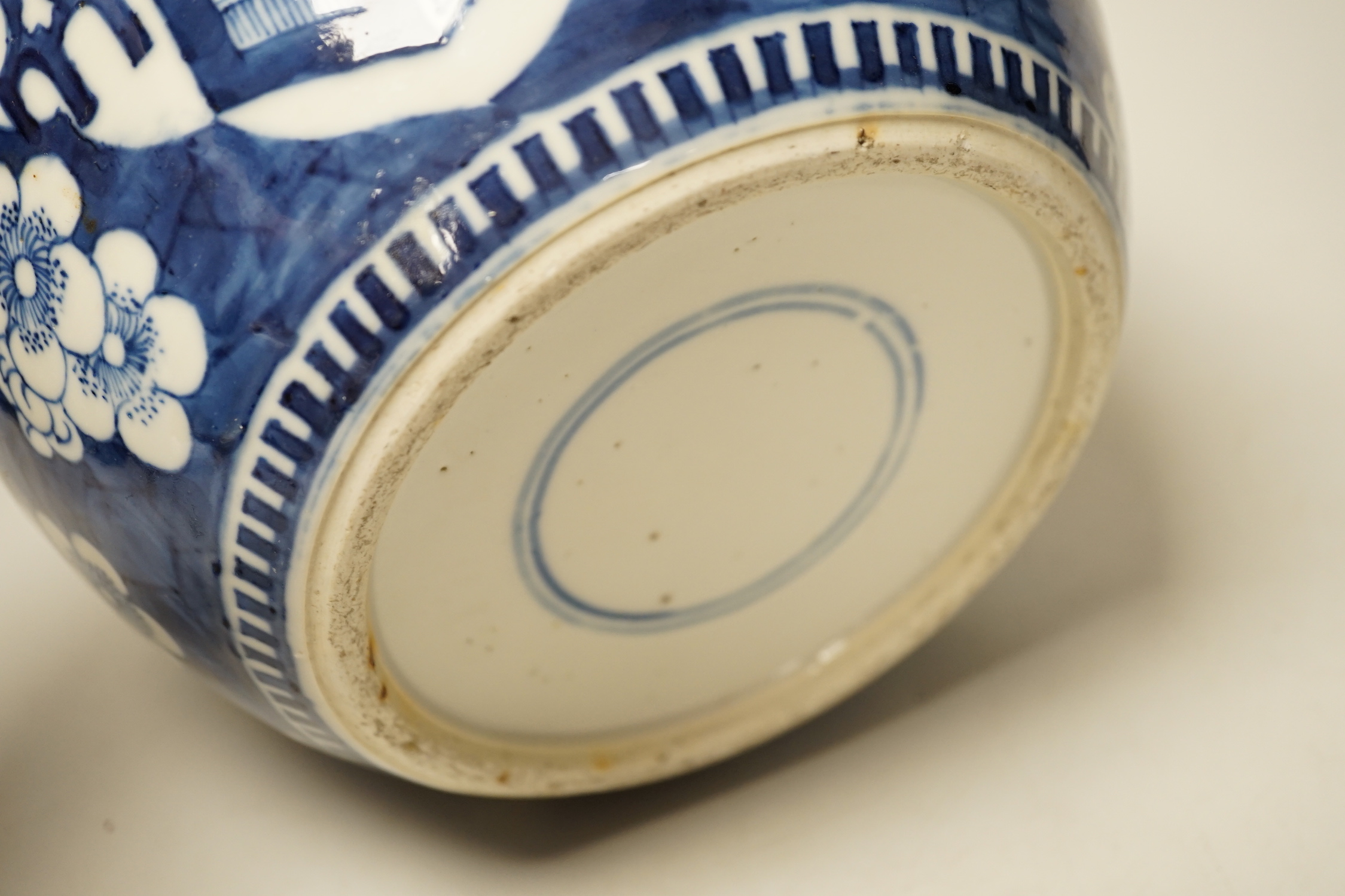 A 19th century Chinese blue and white prunus jar and carved wood cover, 24cm